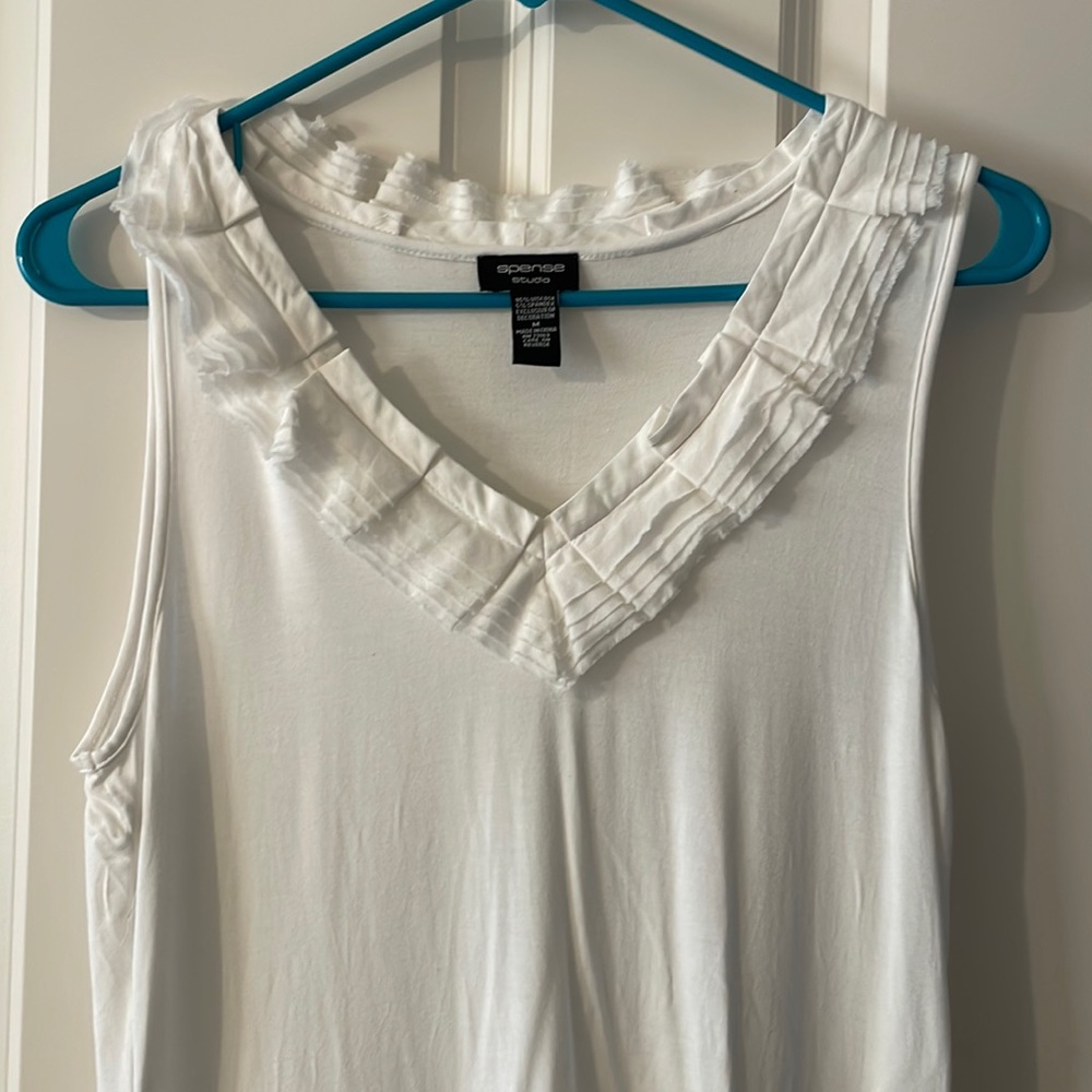 White sleeveless blouse, work professional under suit